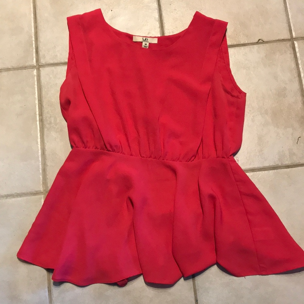 Pink peplum top with open back